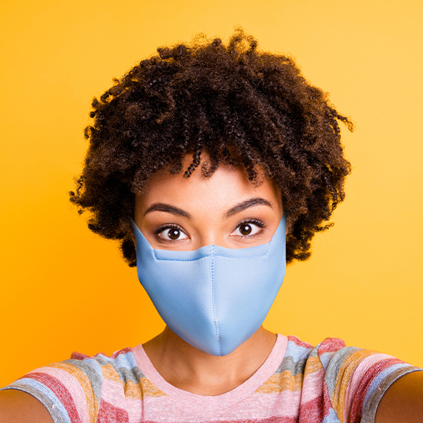 Woman wearing a blue mask.